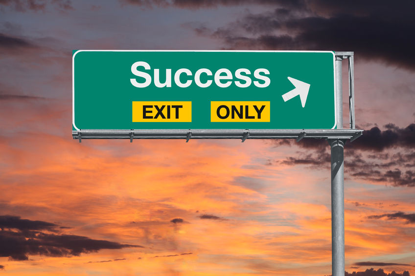 59199717 - success exit only highway sign with sunrise sky.