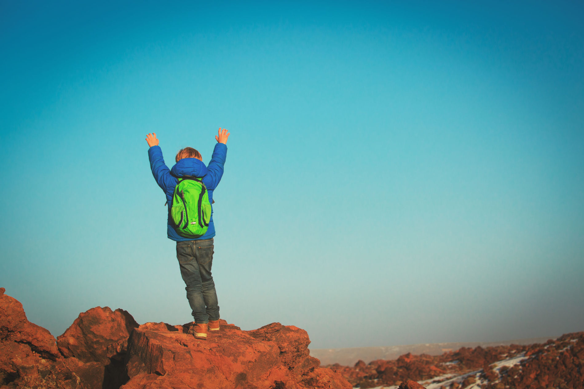 little boy hiking climbing in mountains, active kids