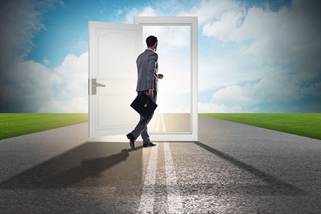 Businessman in front of door in business opportunities concept