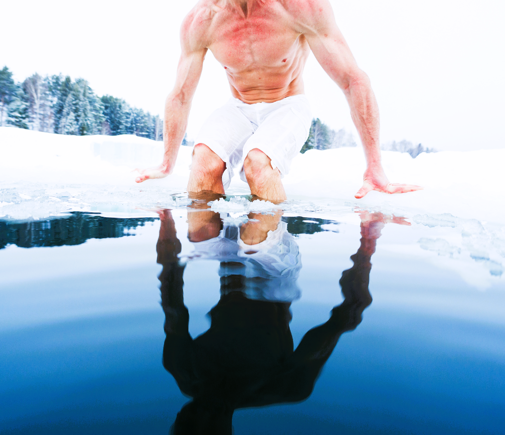 Man entering frozen lake for healing