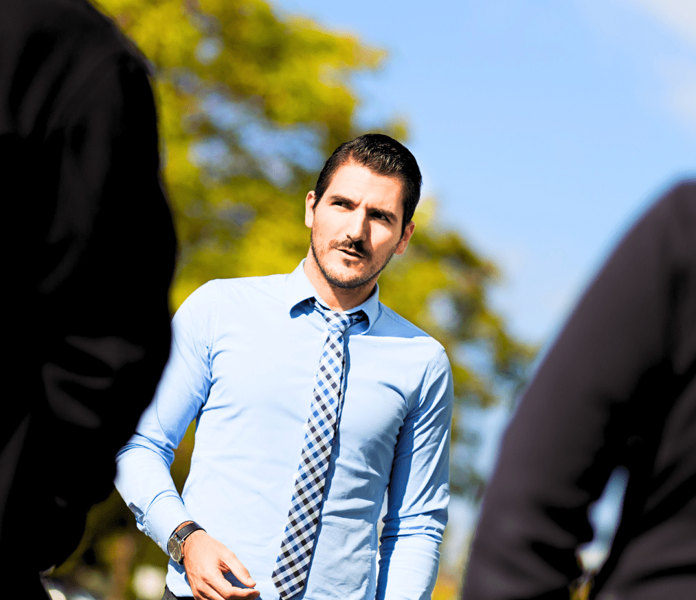 man in blue shirt concerned about leadership corruption