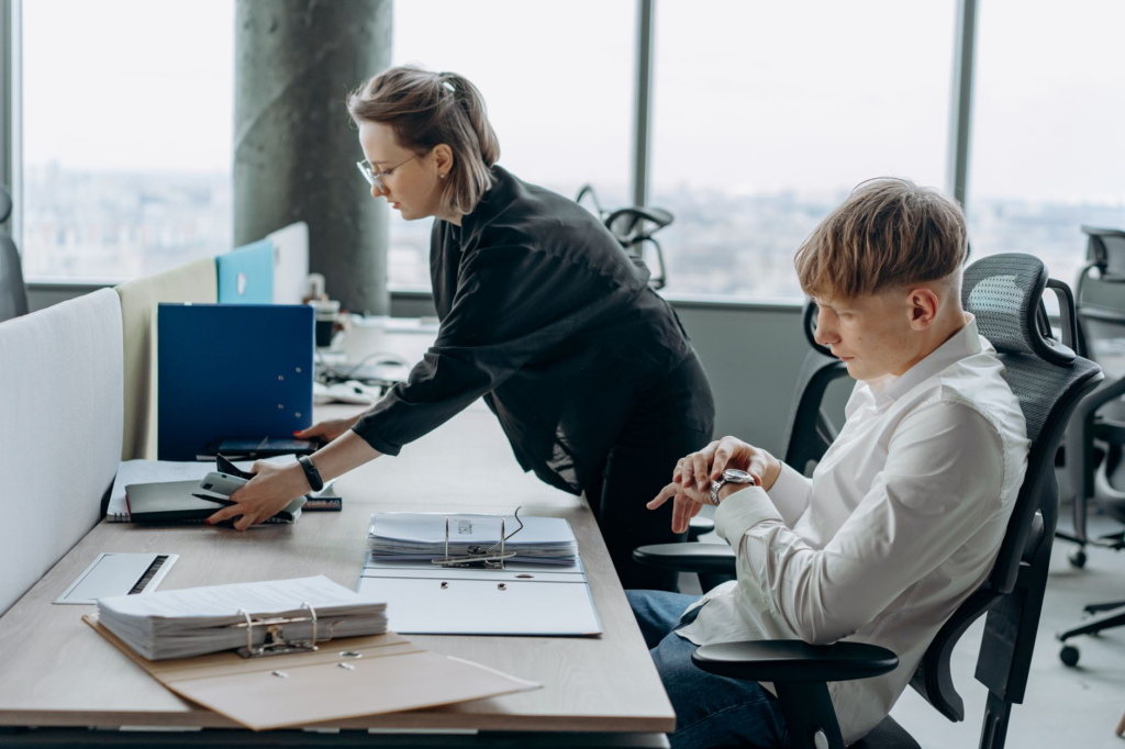 One employee standing apart from a group, symbolizing over-reliance on a single team member